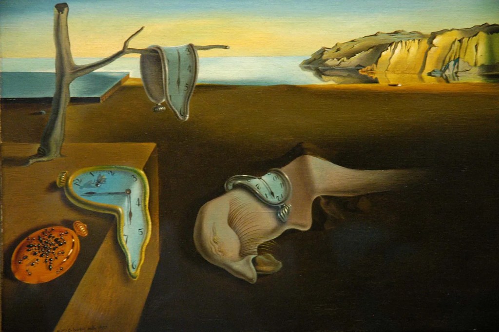 A surreal landscape featuring melting clocks on a barren table, with a desolate shoreline and cliffs in the background, capturing themes of time and dreamlike reality.